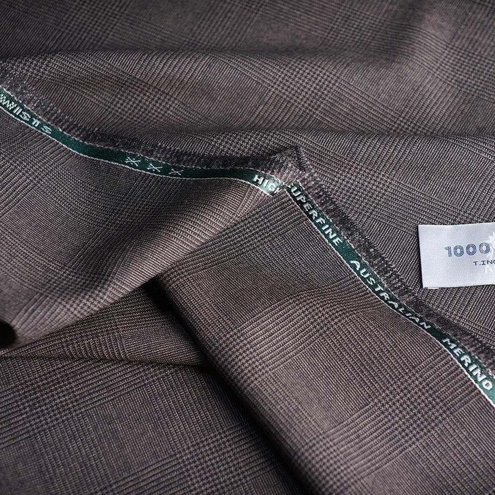 Dark checked fabric with a visible woven edge